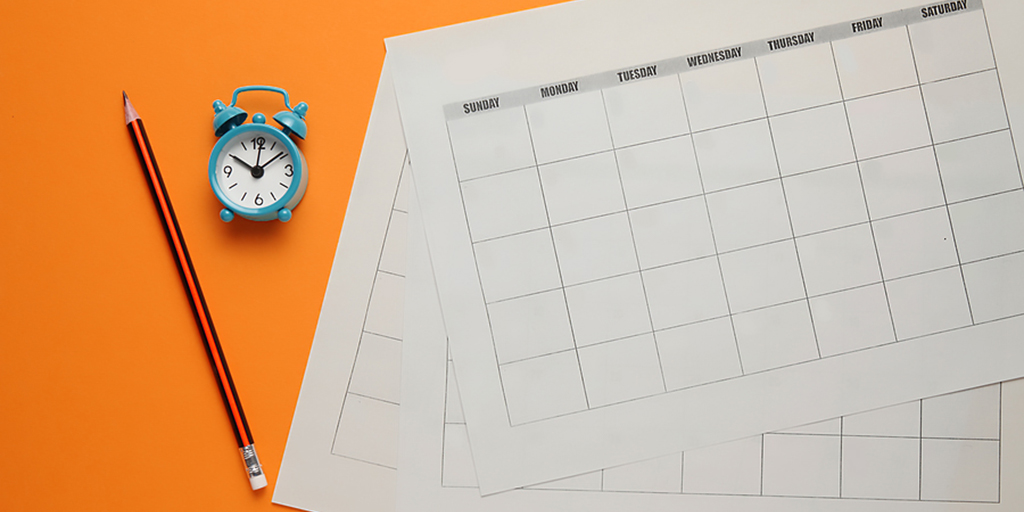 Blank calendar, pencil, and clock illustrate the nonprofit editorial calendar.