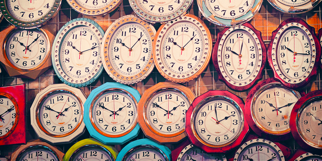 Colorful photo of many different wall clock on the wall illustrates the nonprofit time allocation tool.