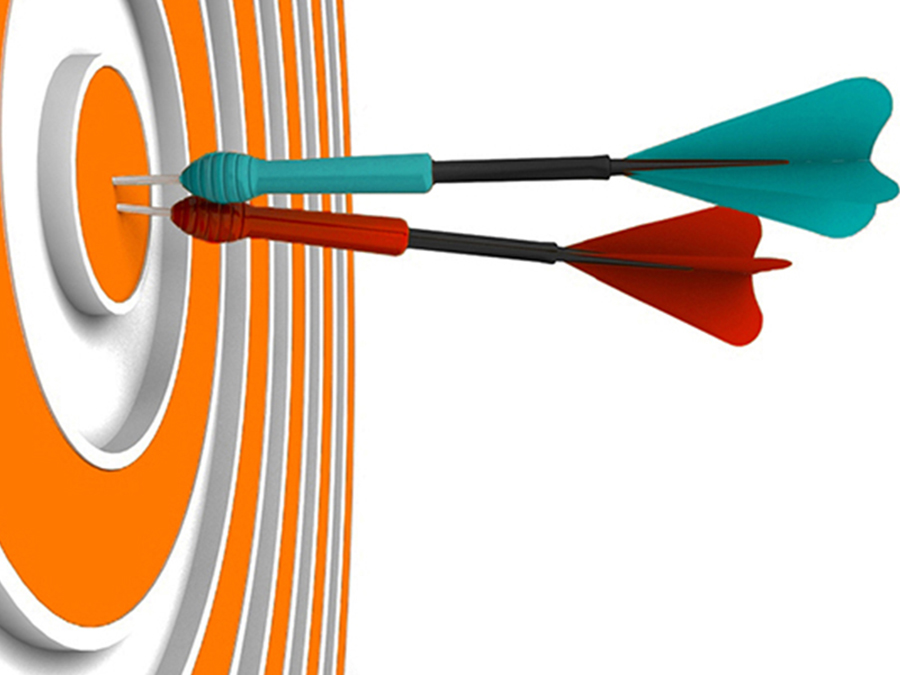 Orange target with teal and red darts as illustration of meeting special event and campaign goals.