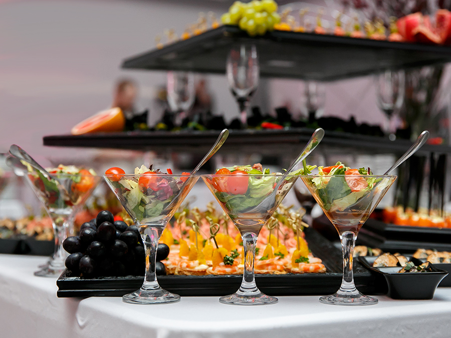 Beautifully decorated catering banquet table with canape, vegetables illustrates special events